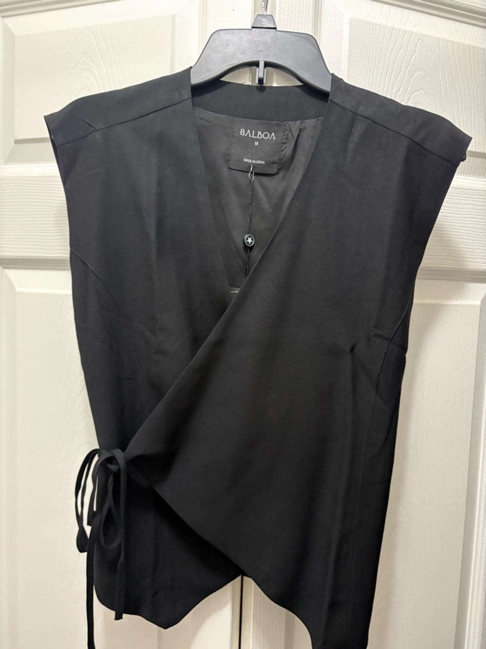 Balboa Black Sleeveless Wrap Top and cargo pants can cinch the bottom ankle